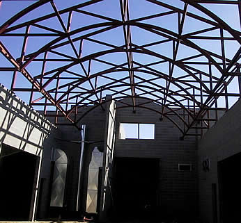 Whitefish School interior arched truss ground view